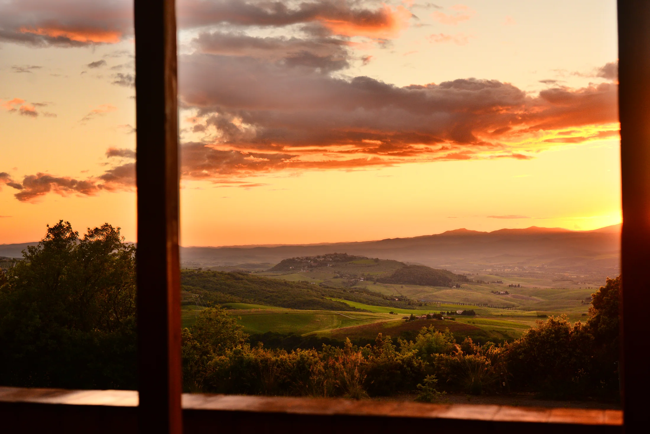 Sunset over the rolling Tuscan hills seen from Villa Gaia